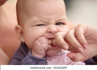 Little Baby Biting Her Mother Finger