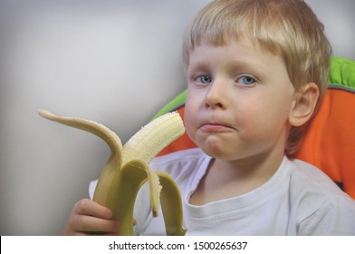 Little Baby Boy Eating Banana Fruit