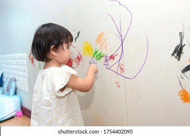  Little Baby Boy And Girl Drawing With Crayon Color On The Wall