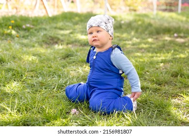 Little Baby Boy Portrait Of Child Outdoor With Strabismus Eyes