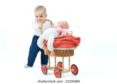 little baby boy pushing toy pram, on white