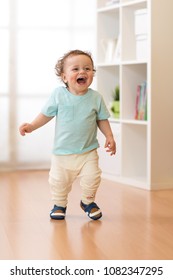 Little Baby Boy Running And Laughing In Ther Living Room