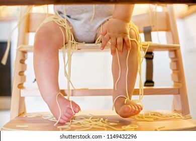 Little Baby Boy, Toddler Child, Eating Spaghetti For Lunch And Making A Mess At Home In Kitchen