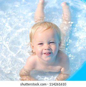 little baby boy in the water pool