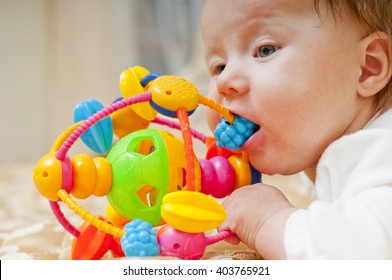 Little Baby Chewing A Toy