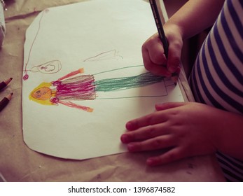 Little baby child draws a simple drawing . top view - Shutterstock ID 1396874582