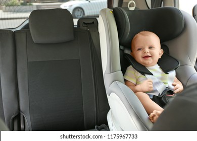 Little Baby In Child Safety Seat Inside Of Car