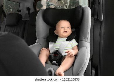 Little Baby In Child Safety Seat Inside Of Car