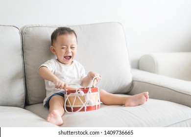 Little Baby Drummer Boy Playing And Hitting The Drum Set At Home.Asian Boy Playing And Singing Happy Moment In Music Lesson Time.Child Development And Executive Function In Child Concept.