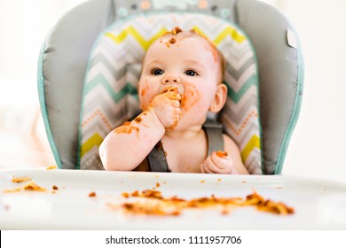 Little Baby Eating Her Dinner And Making A Mess