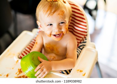 Little Baby Eating Spaghetti Dinner And Making A Mess