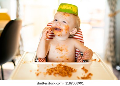 Little Baby Eating Spaghetti Dinner And Making A Mess