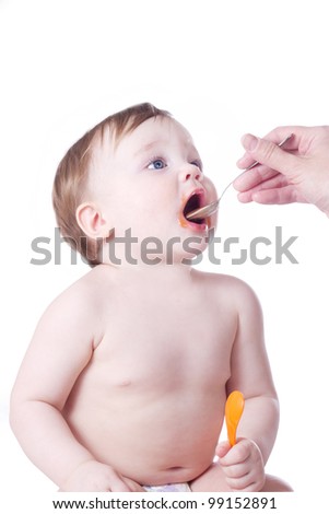 Similar – Happy adorable infant baby boy child smiling while eating two frozen fruit popsicle ice creams in simmer.