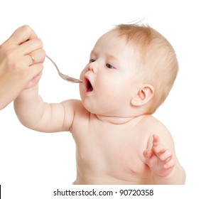 Little Baby Feeding With A Spoon