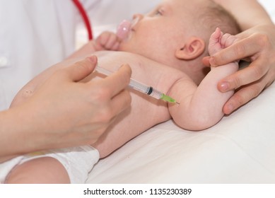 Little Baby Getting A Vaccine Shot In Arm