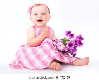 Little Baby Girl In Pink Dress  And Bouquet  Flowers