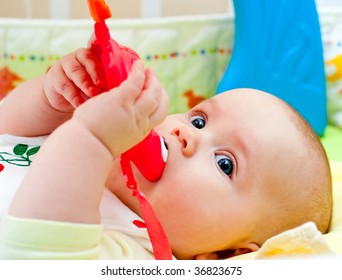 Little Baby Girl Playing With Teething Toy