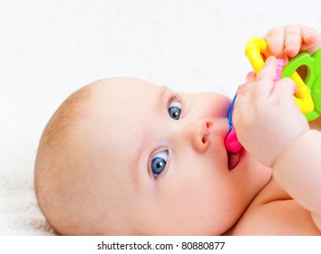 Little Baby Girl Playing With Teething Toy