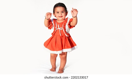 Little Baby Girl Standing Pose Wearing Stylish Frock, Isolated On White Background