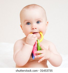 Little Baby Girl With Teething Toy