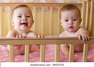 Little Baby Girls In Crib Together