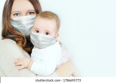 Little Baby And Mother In Medical Protective Face Mask On White Background