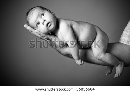 Similar – Baby girl four months old having her bath