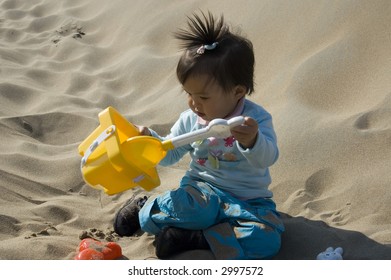 Little Baby Playing At The Beach