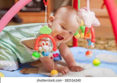 Little Baby Playing With Toys At Home