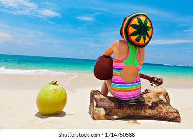 Little Baby In Rasta Hat Play Reggae Music On Hawaiian Ukulele, Enjoy Relaxing On Ocean Beach. Kids Healthy Lifestyle. Family Summer Holiday. Activity On Tropical Jamaica And Caribbean Island Travel.