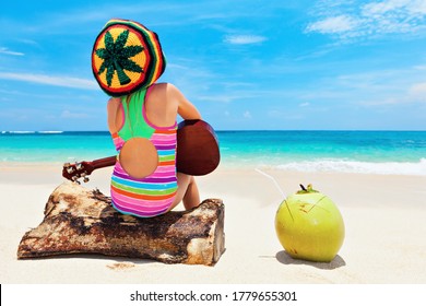 Little Baby In Rasta Hat Play Reggae Music On Hawaiian Ukulele, Enjoy Relaxing On Ocean Beach. Kids Healthy Lifestyle. Family Summer Holiday. Activity On Tropical Jamaica And Caribbean Island Travel.