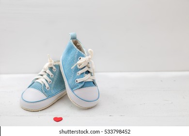  Little Baby Shoes On White Background
