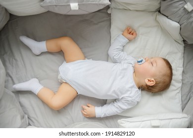 Little Baby Sleeping In Crib , Top View