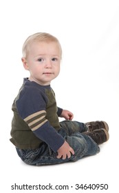 Little Baby Toddler Sitting Sideways On White Background