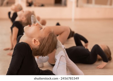 Little ballerinas warming up in the dance hall.  - Powered by Shutterstock