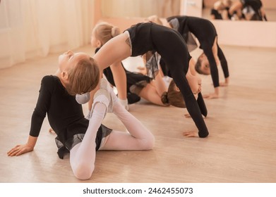 Little ballerinas warming up in the dance hall.  - Powered by Shutterstock