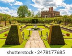 Little banqueting house in Privy gardens of Hampton Court palace in spring, London, UK