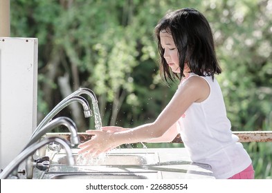 Little Beautiful Asian Girl Washing Hand