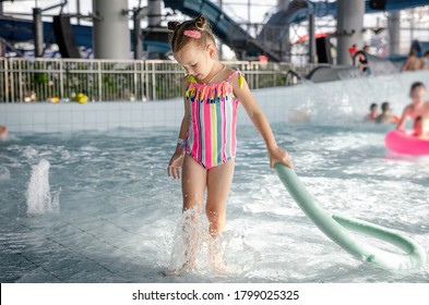 Little Beautiful Girl Playing Foam Noodle Stock Photo (Edit Now) 1798772506