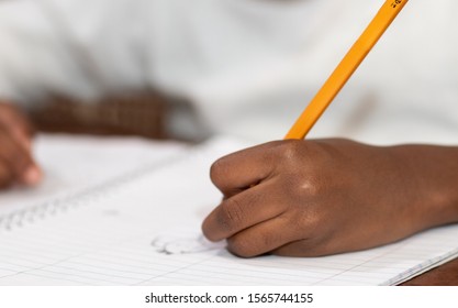 Little Black Girl Drawing With Her Left Hand.