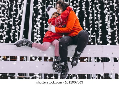 Little Black Girl Enjoying In Ice Skating With Her Mother.