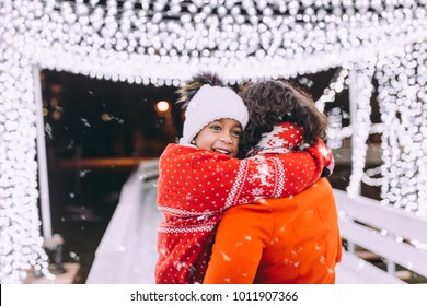 Little Black Girl Enjoying In Ice Skating With Her Mother.