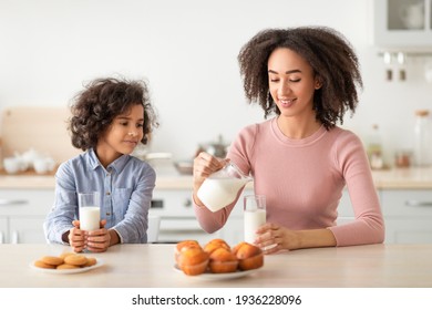 Little Black Girl And Woman Drinking Milk