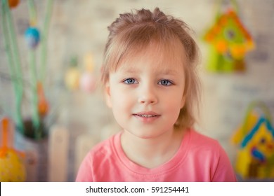 Little Blonde Girl In Easter Decorations