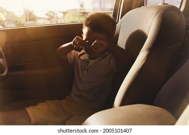 Little Boy Was Alone In The Car, Crying, Shocked And Worried By The Lack Of Care From His Parents Who Left Alone In The Seat Of The Car : Neglect Leading To Accidents And Negligence Concept