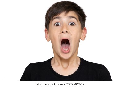 Little Boy Asian Kid Wearing Casual Black Tshirt Scared And Amazed With Open Mouth For Surprise, Disbelief Face. Isolated On The White Background