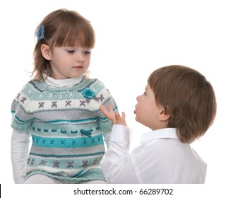 A Little Boy Is Asking A Little Girl For A Permission, Standing On His Knees; Isolated On The White Background