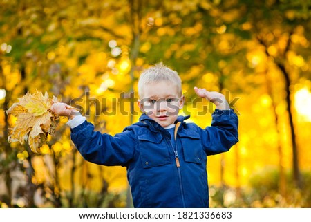 Similar – Image, Stock Photo Sun always shines after the rain. Small bond infant boy wearing yellow rubber boots and yellow waterproof raincoat walking in puddles in city park on sunny rainy day.