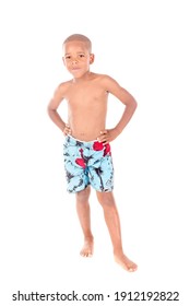 little boy with beach shorts isolated in white background
