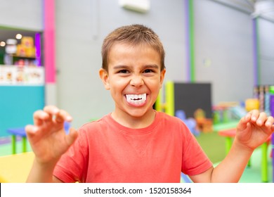 Little Boy With Big Plastic Vampire Teeth Toy For Halloween